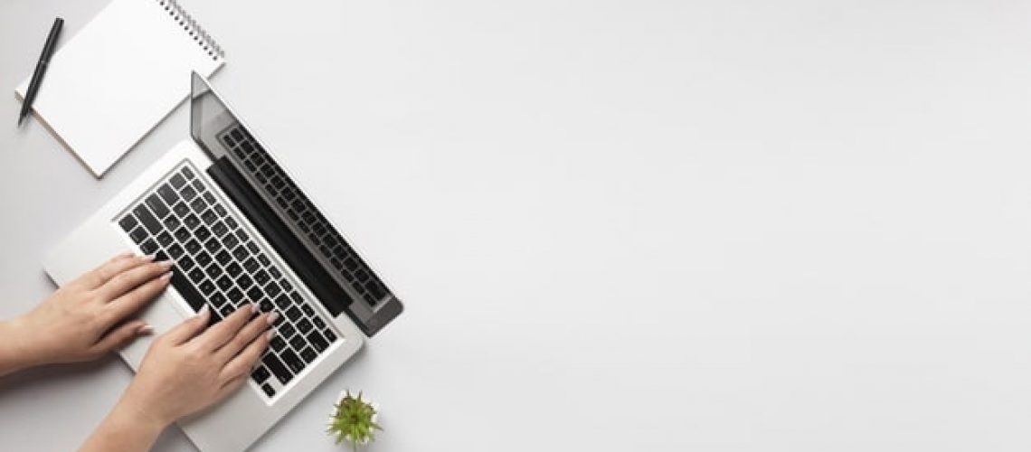 top-view-person-writing-laptop-with-copy-space_23-2148708035.jpg
